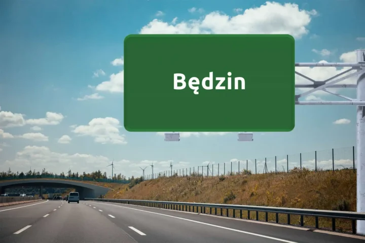 duży, zielony znak drogowy z nazwą Będzin, wiszący nad autostradą